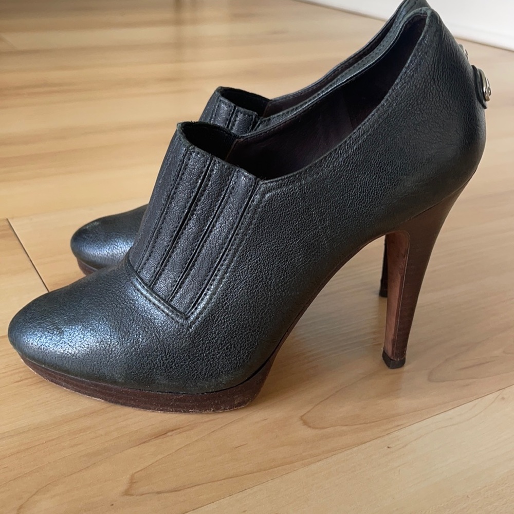 BCBG Maxazria booties size 7, a gently used, dark green color, all leather.